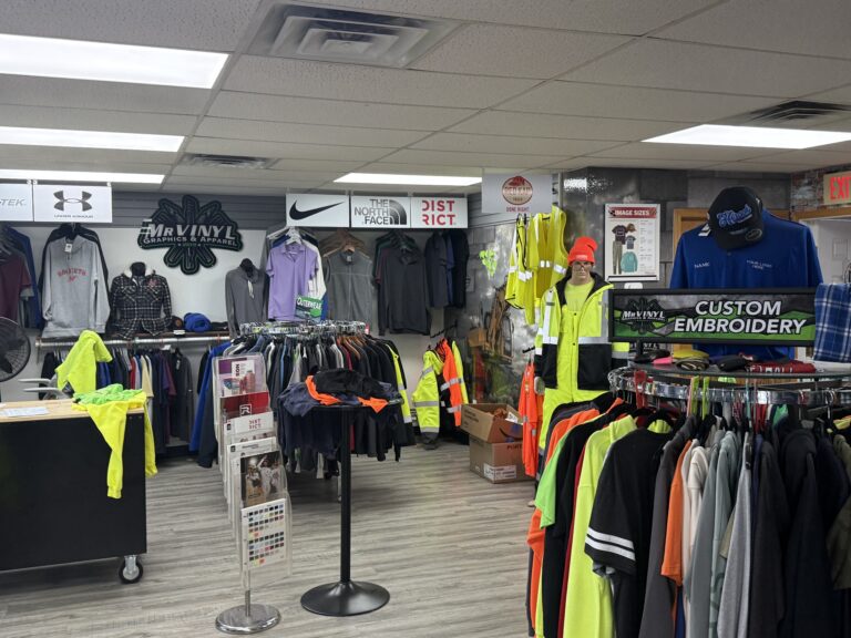 Custom apparel and embroidered clothing on display at Mr. Vinyl